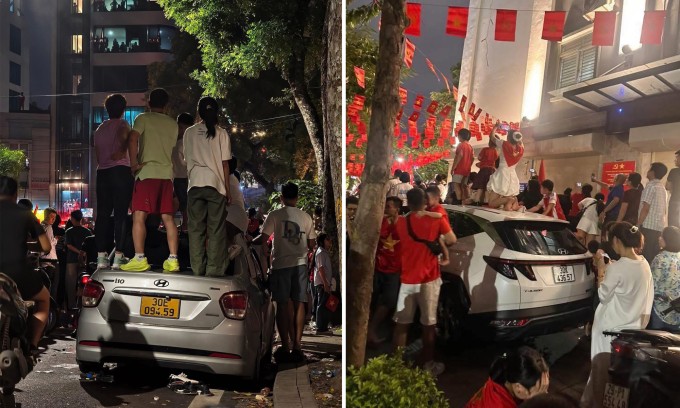 Hình ảnh người dân leo lên ôtô đỗ ven đường để xem diễu binh tối 24/8. Ảnh: N.T.T