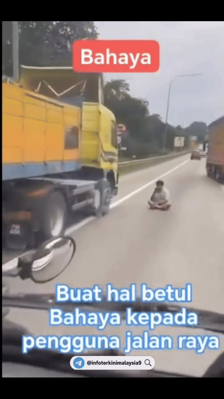 Tài xế xe tải dừng xe ở lề đường, ngồi khoanh chân làm 1 việc khiến ai đi qua cũng lắc đầu khó hiểu- Ảnh 2.